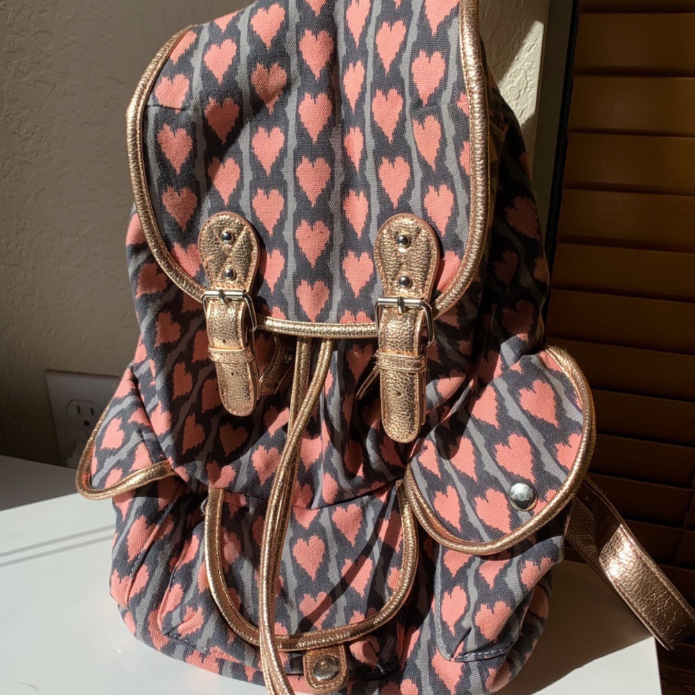 pink heart book bag with gold accents